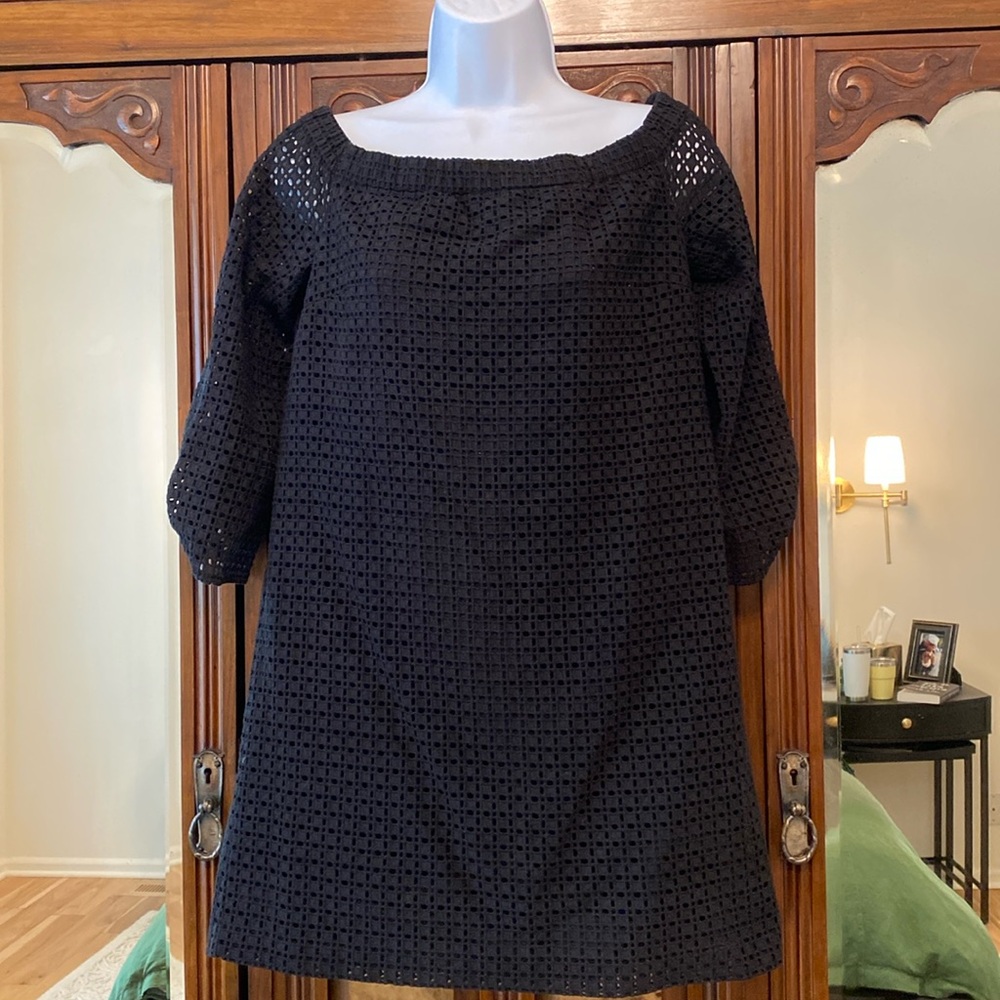 Short, black eyelet dress and a size small can be worn off the shoulder
